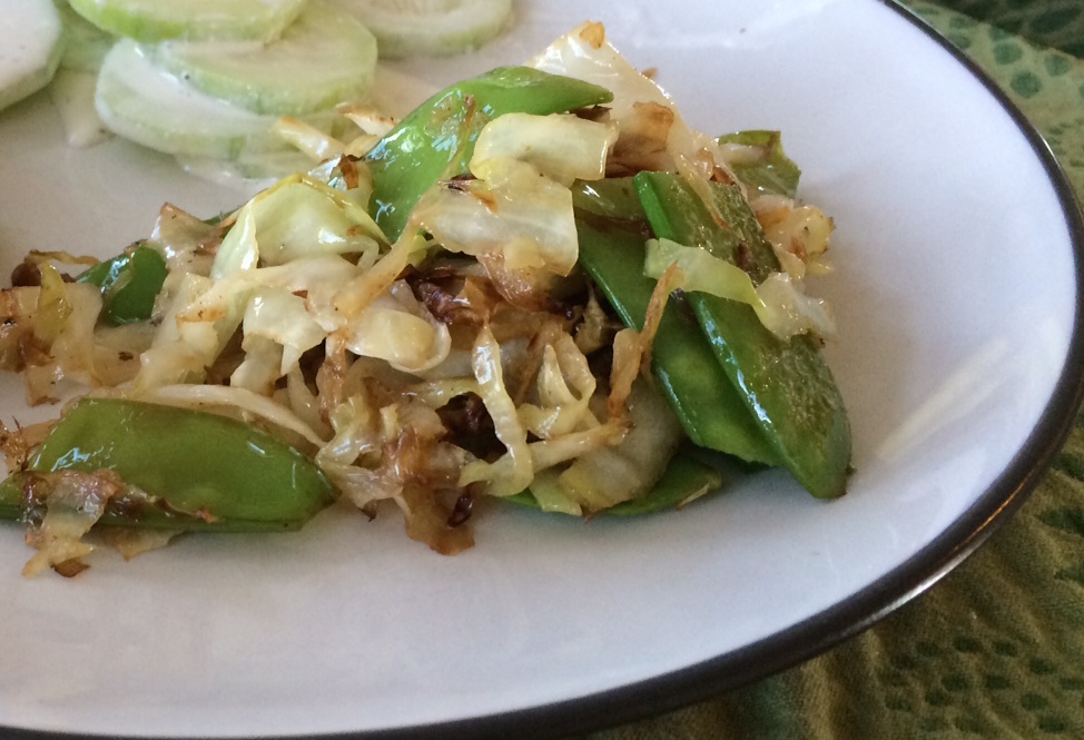 Fried cabbage with snow peas side dish